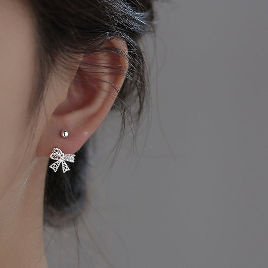 Hollow bow screw earrings